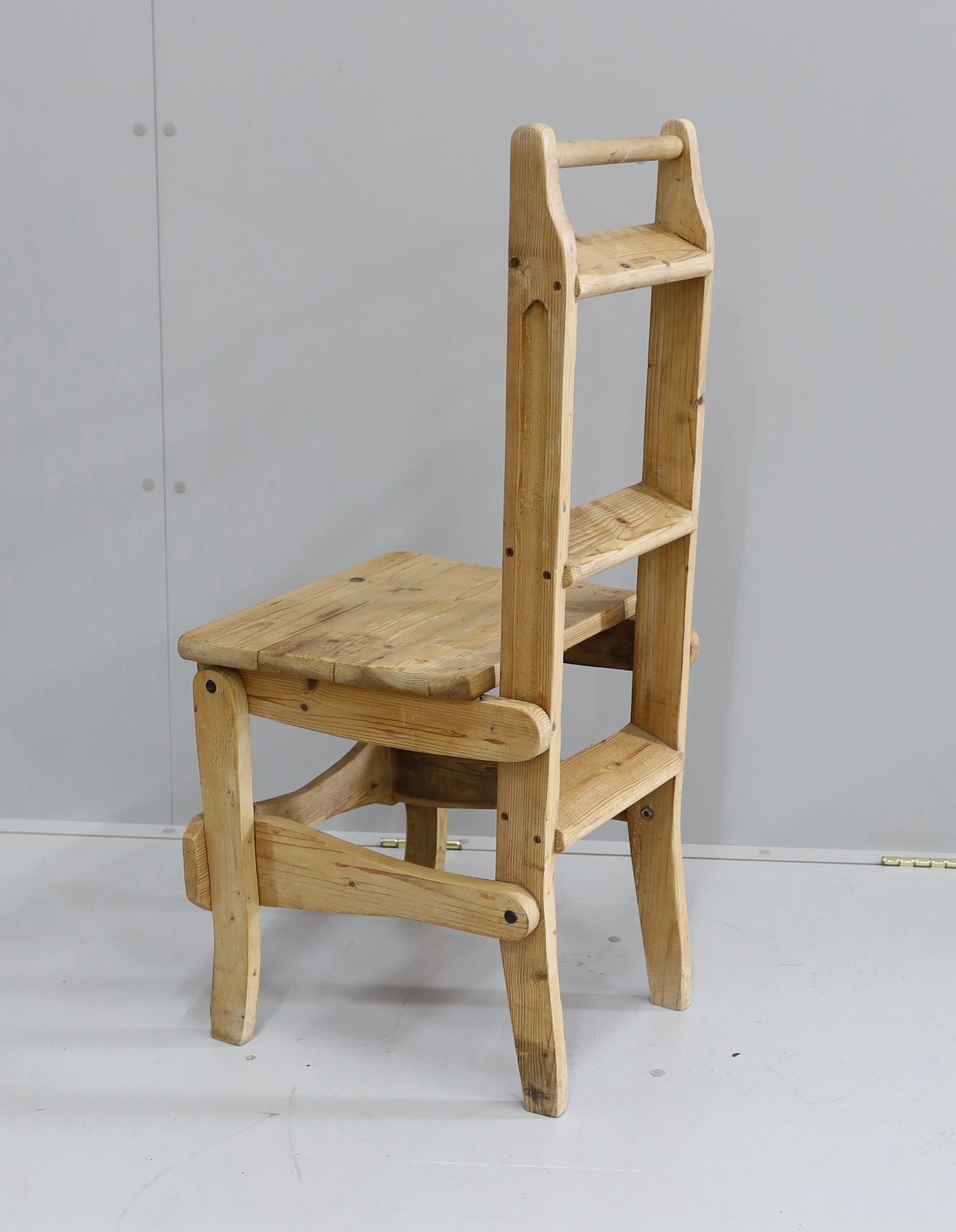 A provincial pine metamorphic library chair